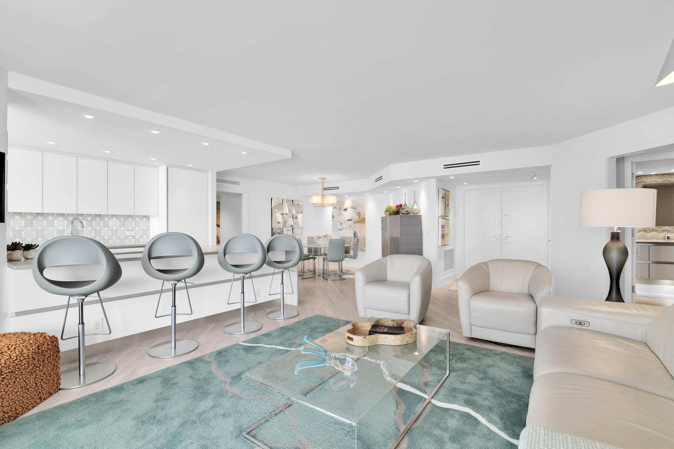 550 South Ocean Boulevard, Unit 1004 Boca Raton, FL 33432 - Photo 4 of 74 a living room with furniture a table and chair