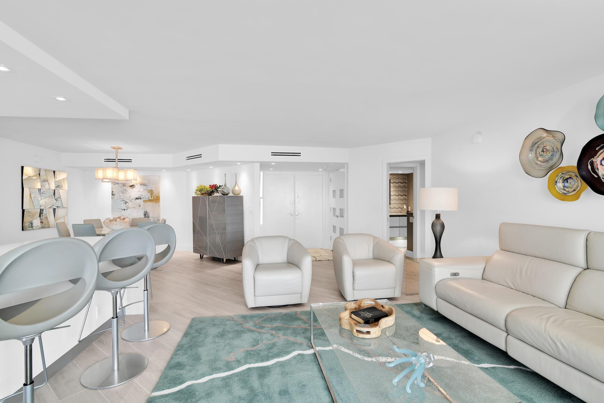 550 South Ocean Boulevard, Unit 1004 Boca Raton, FL 33432 - Photo 6 of 74 a living room with furniture and wooden floor