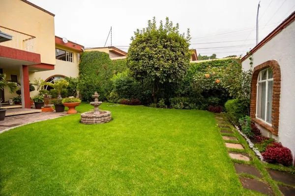 a view of backyard with swimming pool