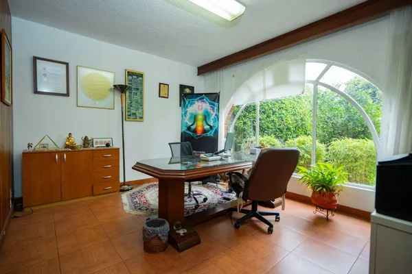 a living room with fireplace furniture and a flat screen tv