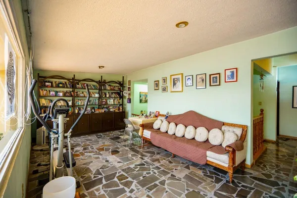 a view of a balcony with furniture