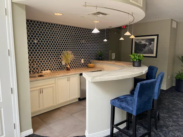 a kitchen with a sink cabinets and wooden floor