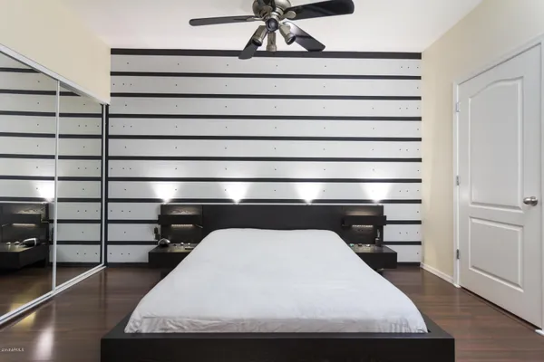 a living room with a balcony and furniture