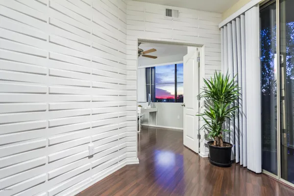 a potted plant sitting on a wooden floor