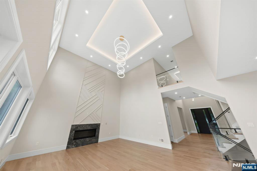 317 Edstan Way Paramus, NJ 07652 - Photo 14 of 48 an entryway in a hall with a mirror