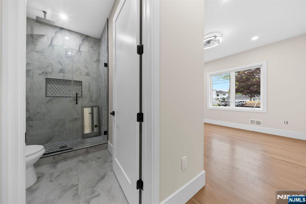 317 Edstan Way Paramus, NJ 07652 - Photo 18 of 48 a view of a bathroom from a hallway