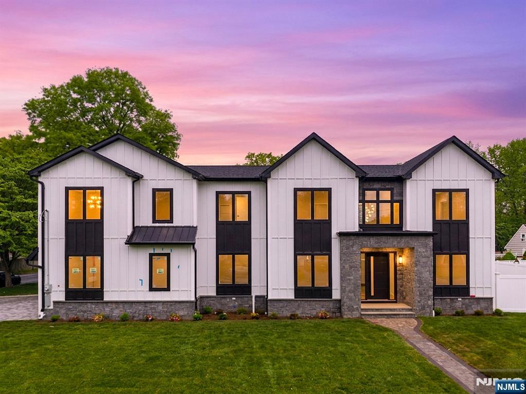 317 Edstan Way Paramus, NJ 07652 - Photo 2 of 48 a front view of a house with a yard