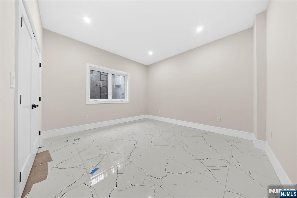 317 Edstan Way Paramus, NJ 07652 - Photo 22 of 48 an empty room with windows