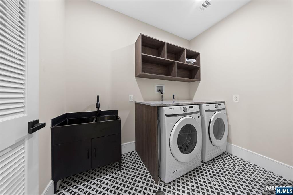 317 Edstan Way Paramus, NJ 07652 - Photo 27 of 48 a utility room with dryer washer and sink