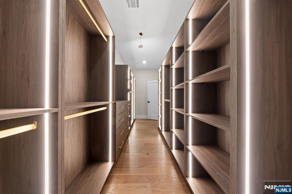 317 Edstan Way Paramus, NJ 07652 - Photo 34 of 48 a walk in closet with wooden floor