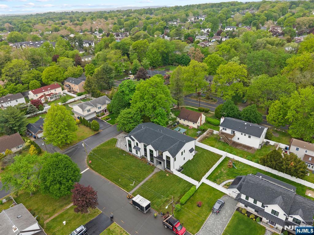 317 Edstan Way Paramus, NJ 07652 - Photo 4 of 48 an aerial view of a tennis ground and a houses