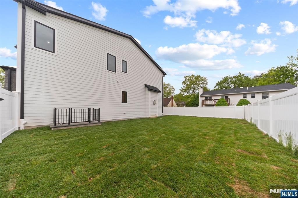 317 Edstan Way Paramus, NJ 07652 - Photo 46 of 48 a view of a backyard with a garden