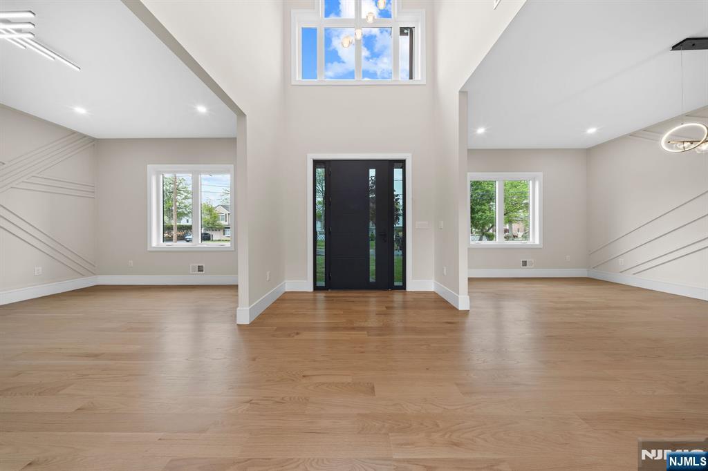 317 Edstan Way Paramus, NJ 07652 - Photo 7 of 48 an empty room with windows and fireplace