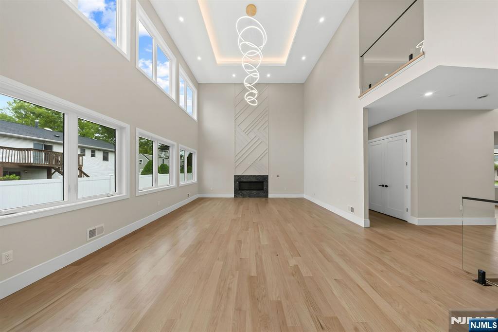 317 Edstan Way Paramus, NJ 07652 - Photo 9 of 48 wooden floor in an empty room with a window