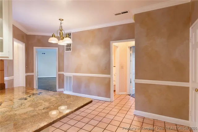 a kitchen with granite countertop a sink and a stove top oven