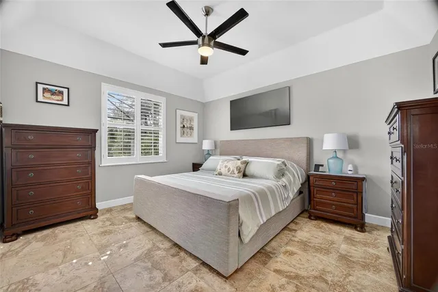 a bedroom with a bed and a dresser