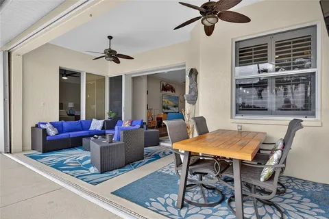 a view of a dining room with furniture and window
