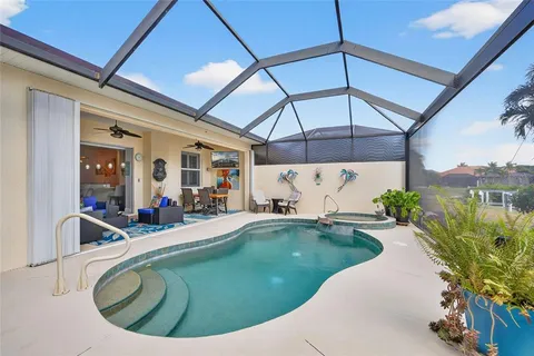 a view of a swimming pool with a patio