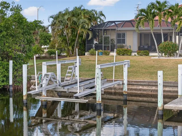 a view of a house with a small yard and plants