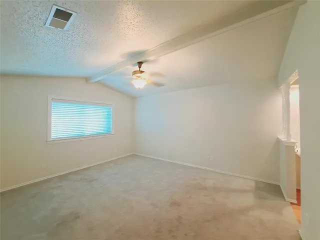 an empty room with a empty space and windows