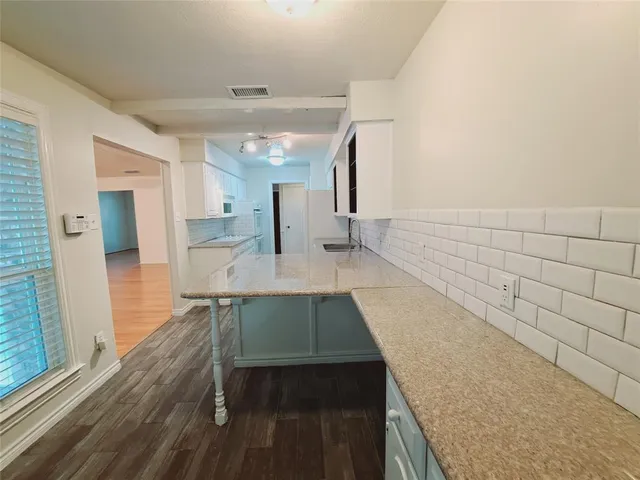 a view of a kitchen from the kitchen