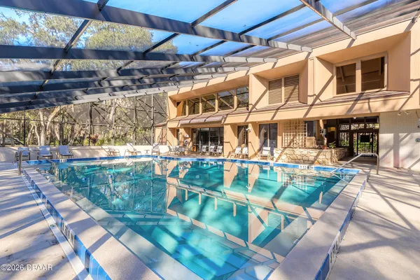 a view of a swimming pool with a patio