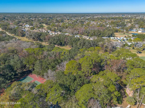 a outdoor space with lots of furniture and wooden floors