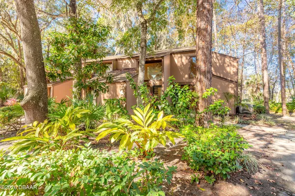 a view of entryway with wooden floor and stairs