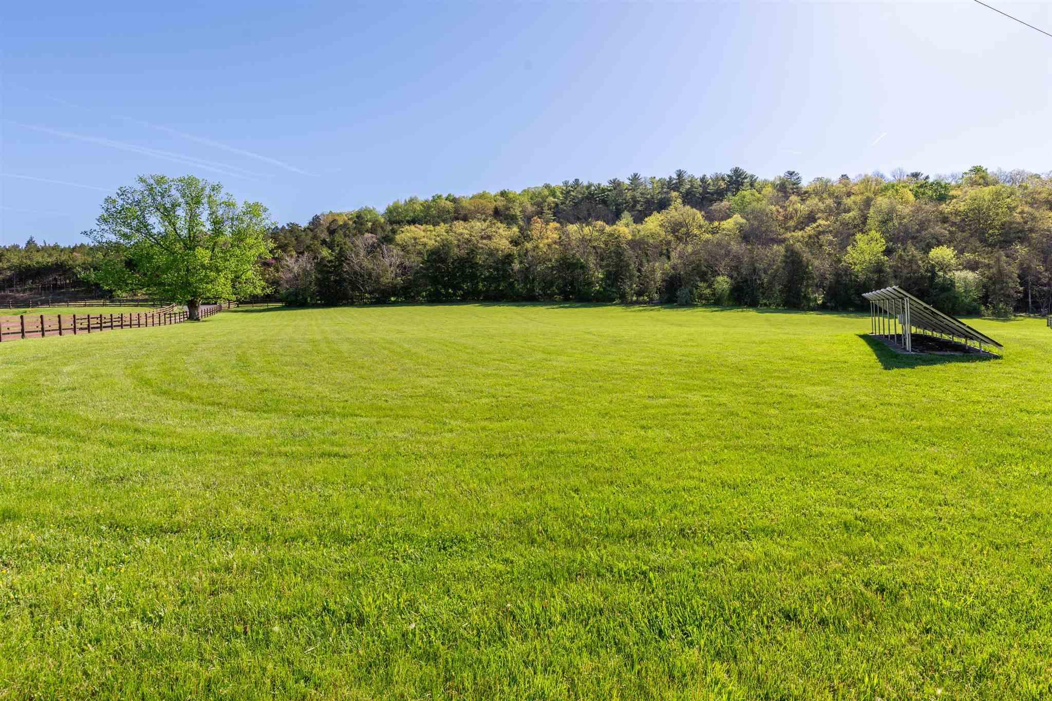 950 Lea Port Road Verona, VA 24482 - Photo 17 of 75 a view of a big yard with an outdoor space and seating area