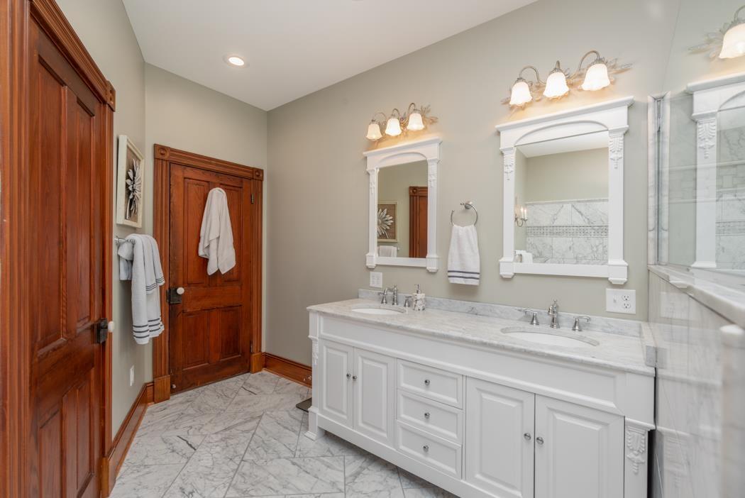 950 Lea Port Road Verona, VA 24482 - Photo 56 of 75 a spacious bathroom with a granite countertop sink mirror and a shower