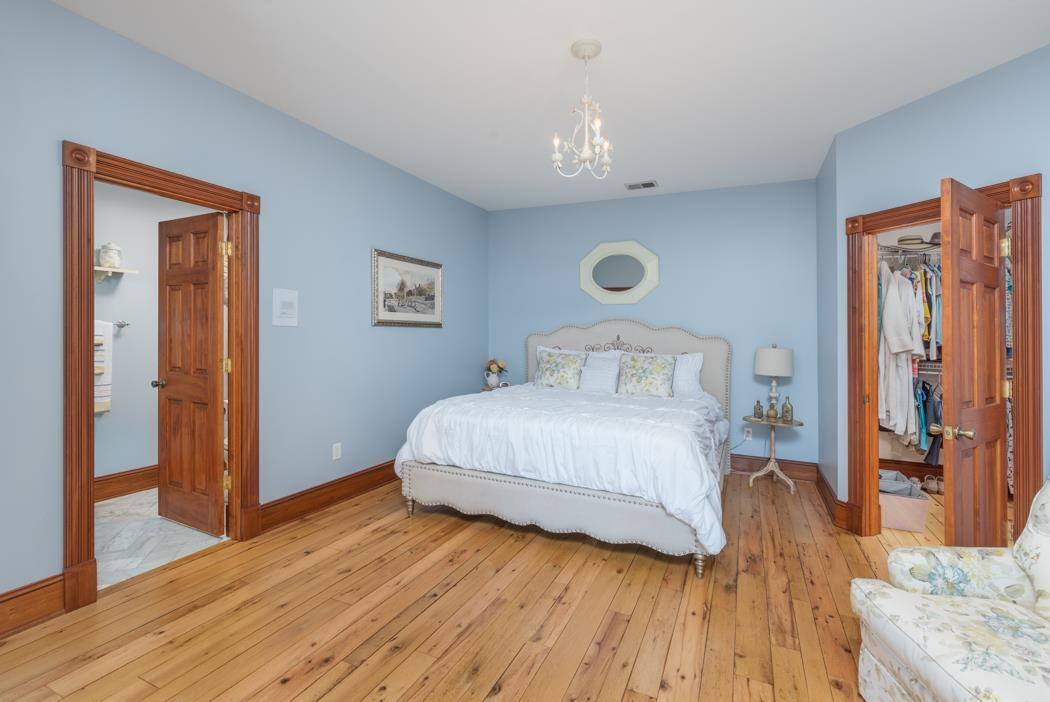 950 Lea Port Road Verona, VA 24482 - Photo 59 of 75 a bedroom with a bed and wooden floor