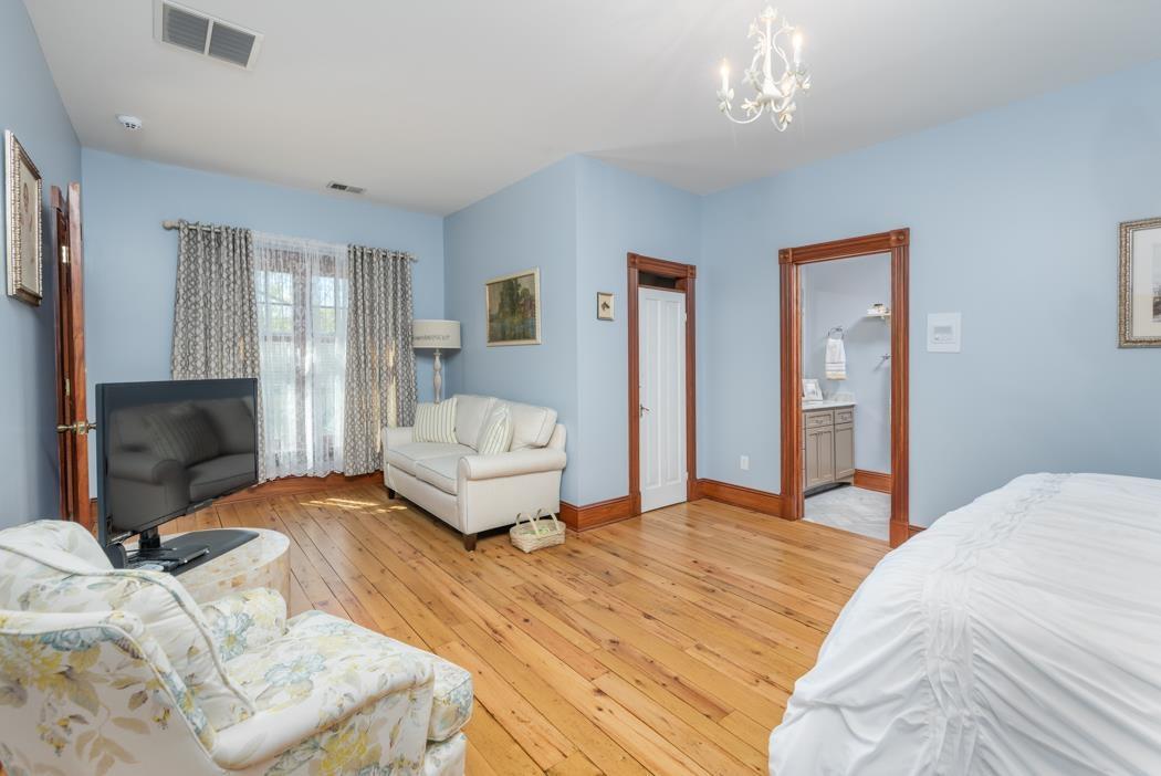 950 Lea Port Road Verona, VA 24482 - Photo 60 of 75 a bedroom with a bed and wooden floor