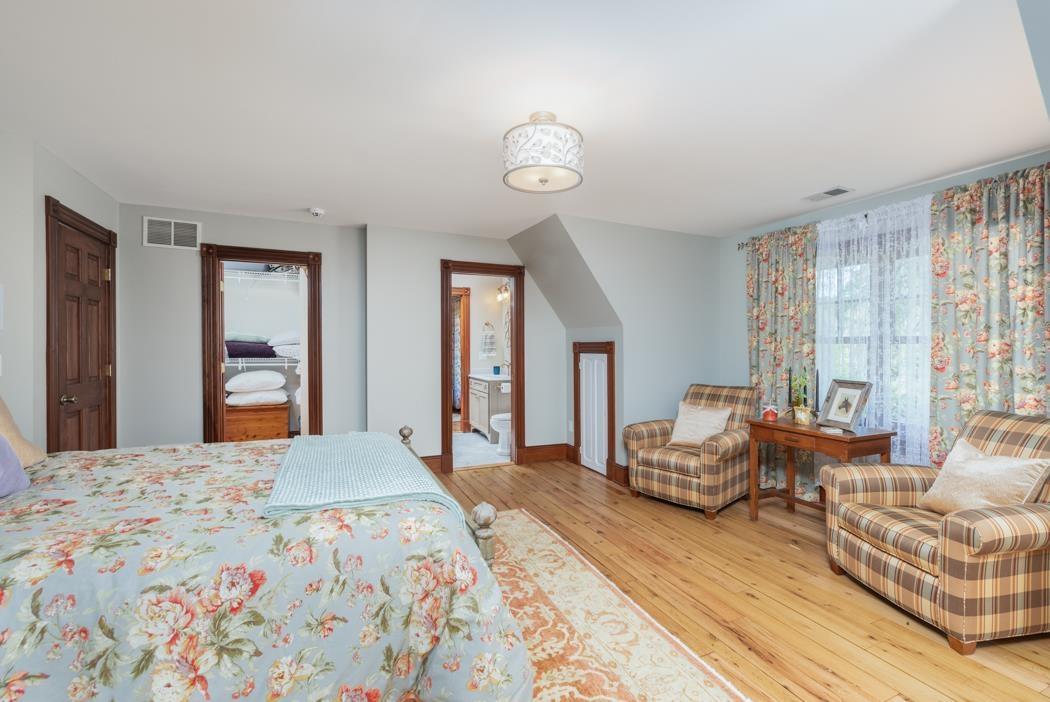 950 Lea Port Road Verona, VA 24482 - Photo 64 of 75 a bedroom with a bed and wooden floor
