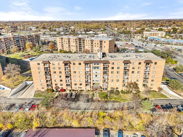 an aerial view of residential building and parking space
