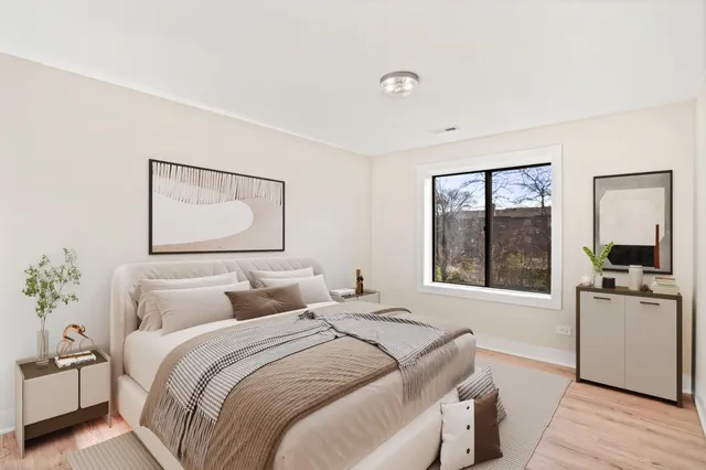a bedroom with a large bed and a window