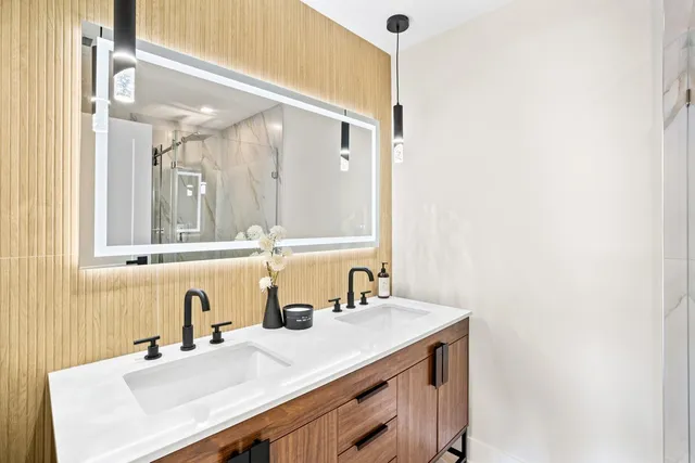 a bathroom with a sink and a mirror