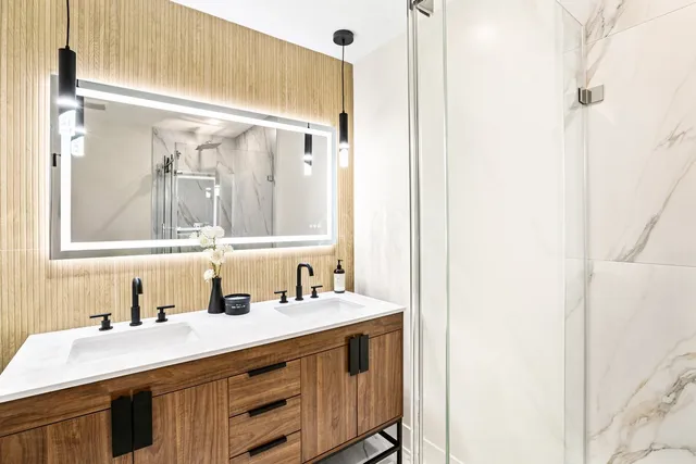 a bathroom with a sink vanity and a mirror