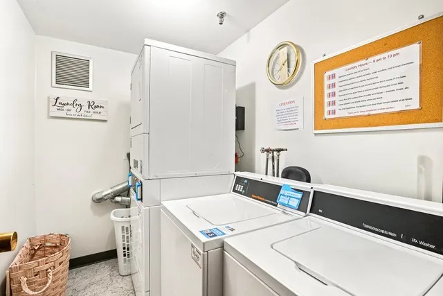 a bathroom with a granite countertop toilet a sink and a mirror