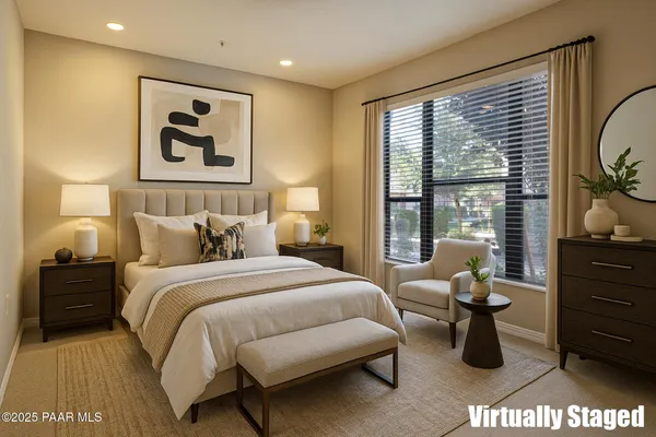 an empty room with closet and a chandelier fan