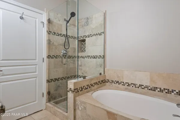 a bath tub sitting next to a white sink
