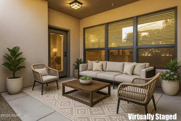 a view of a porch with potted plants