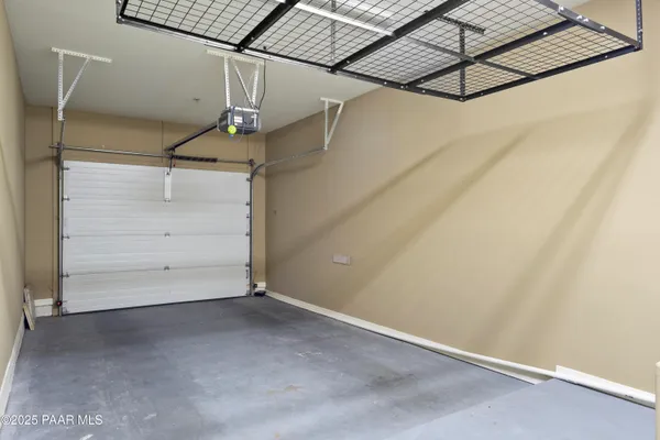 a living room with furniture a fireplace and large windows