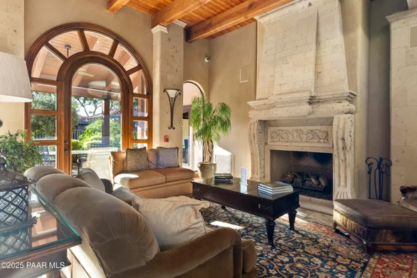 a kitchen with granite countertop a sink stove and refrigerator