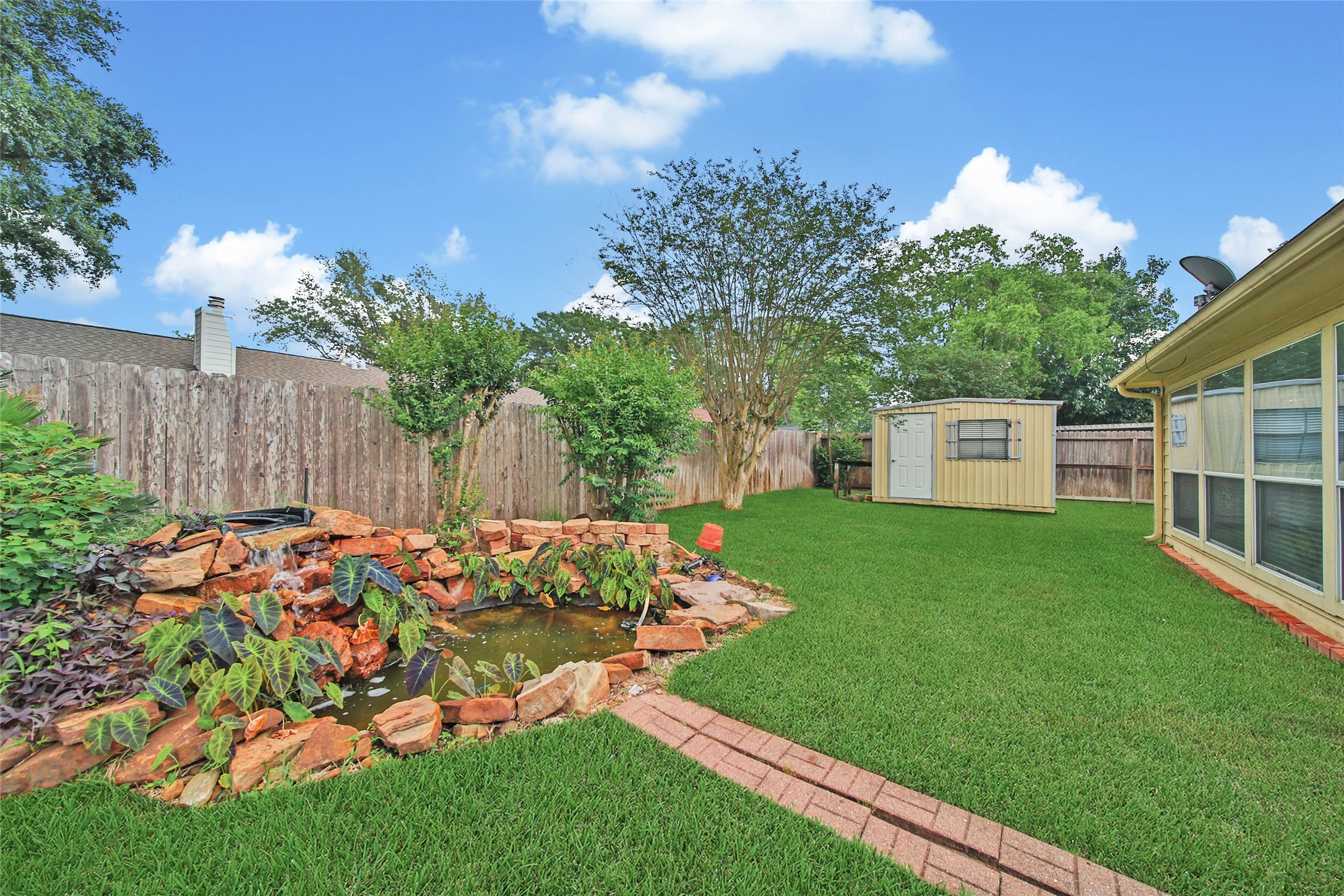 5010 Cupids Bower Court Spring, TX 77388 - Photo 36 of 40 a garden with flowers in front of it