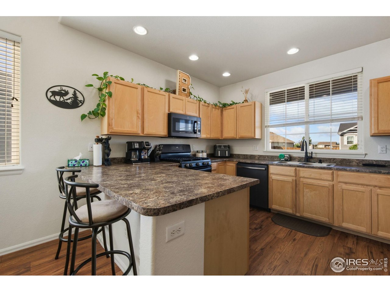 1204 5th Street Pierce, CO 80650 - Photo 7 of 44 a kitchen with kitchen island granite countertop a sink and counter space
