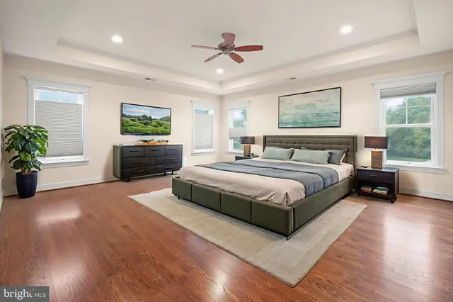 a view of an empty room with a fireplace and window