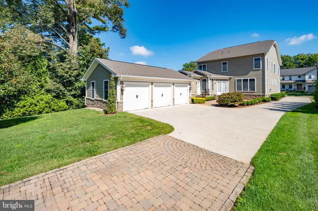 a view of a patio with table and chairs under an umbrella