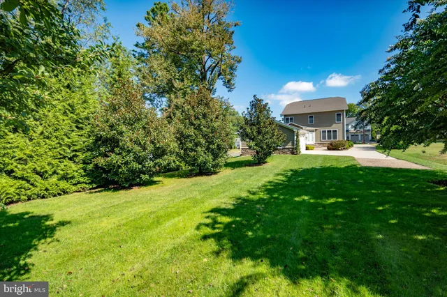 a living room with furniture fireplace and flat screen tv