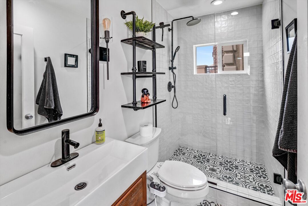 4105 Pacific Avenue, Unit 1 Marina del Rey, CA 90292 - Photo 16 of 29 a bathroom with a sink toilet and shower