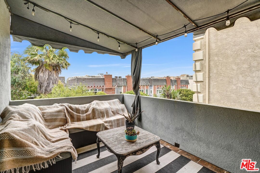 4105 Pacific Avenue, Unit 1 Marina del Rey, CA 90292 - Photo 22 of 29 a living room with furniture and a floor to ceiling window